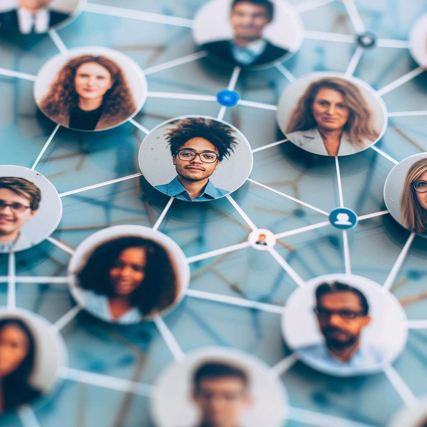 A network diagram featuring headshots of diverse people connected by lines, symbolizing Uniti Wholesale’s nationwide network and the power of technology-driven partnership within a community or organization.